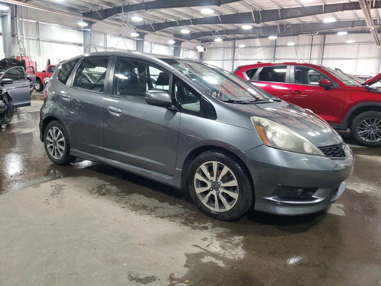 2012 Honda Fit VIN JHMGE8H52CC016359 Copart auction photo, side / hail damage thumbnail 4