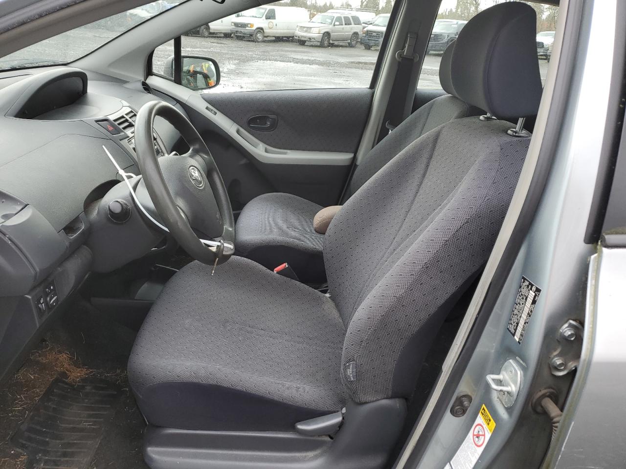 2009 Toyota Yaris VIN JTDKT903095238977 Copart auction photo, side damage thumbnail 7