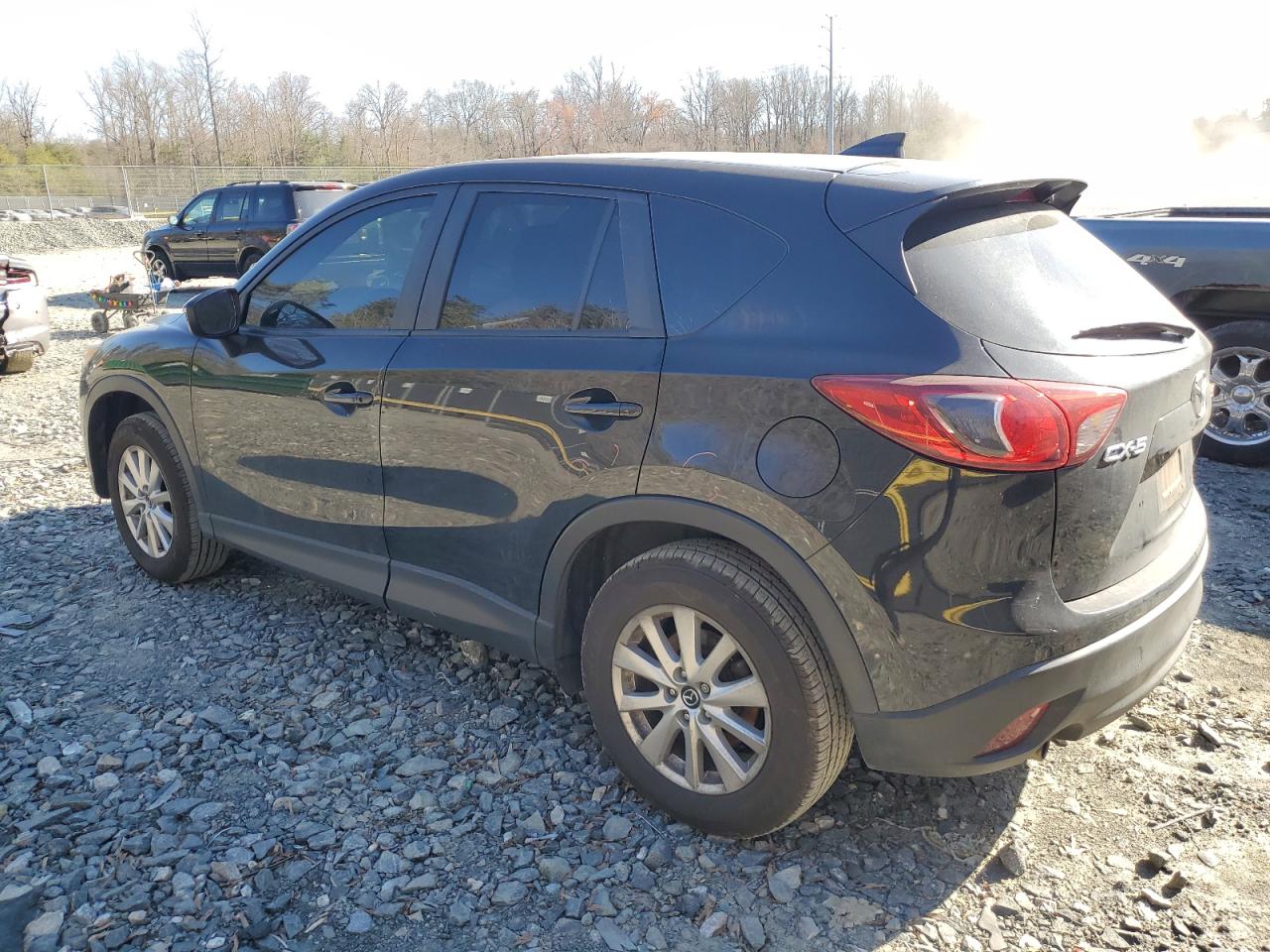 2016 Mazda CX-5 VIN JM3KE2CY2G0713586 Copart auction photo, side damage thumbnail 2