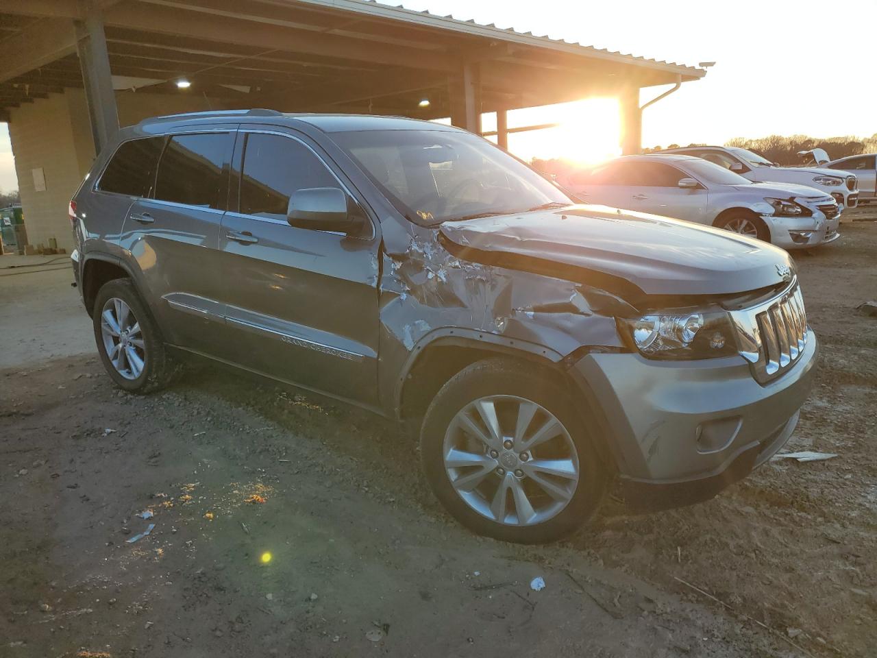 2012 Jeep Grand Cherokee VIN 1C4RJEAT6CC361732 Copart auction photo, front end / side damage thumbnail 4