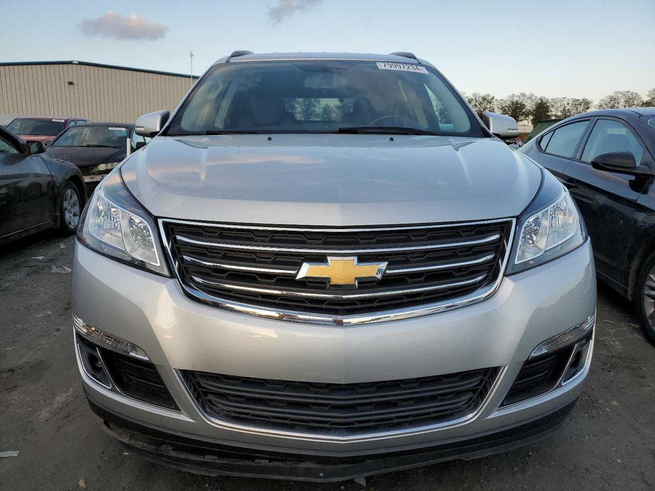 2017 Chevrolet Traverse VIN 1GNKRGKD1HJ101486 Copart auction photo, side / minor dent/scratches damage thumbnail 5
