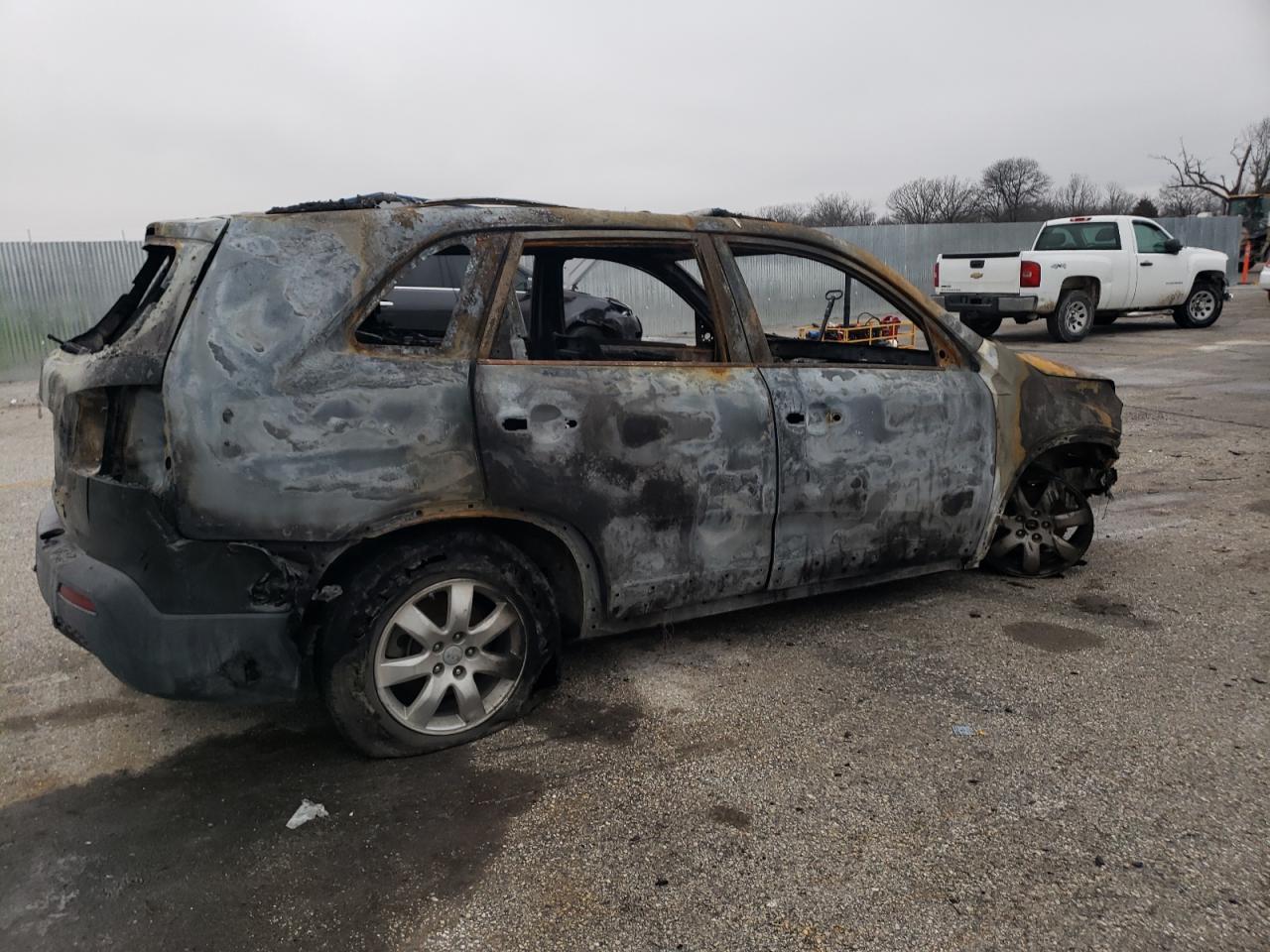 2012 KIA Sorento VIN 5XYKT4A61CG210907 Copart auction photo, burn damage thumbnail 3
