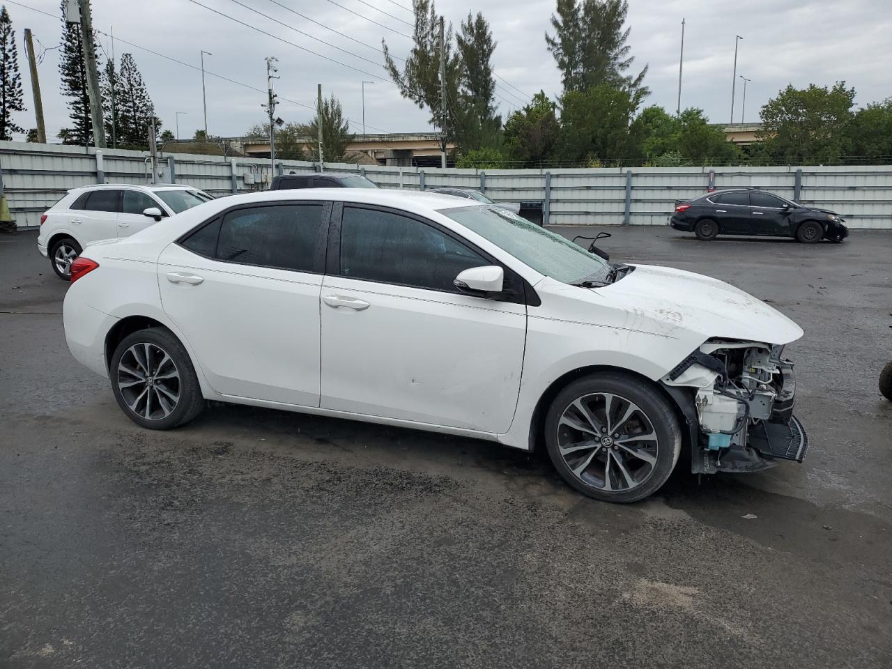 2017 Toyota Corolla VIN 5YFBURHE5HP632432 Copart auction photo, front end / side damage thumbnail 4