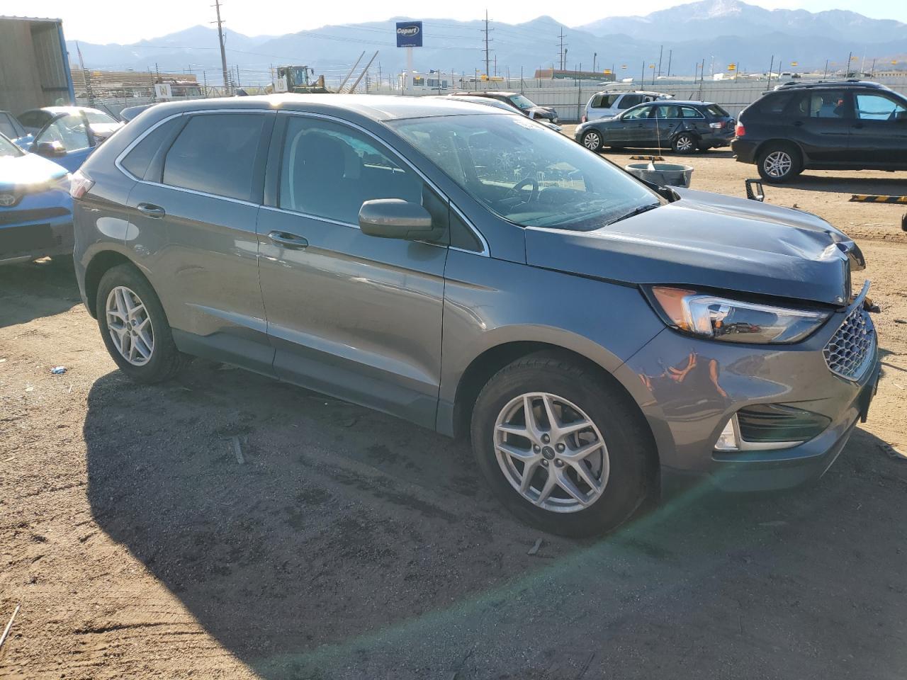 2023 Ford Edge VIN 2FMPK4J95PBA23517 Copart auction photo, front end / side damage thumbnail 4