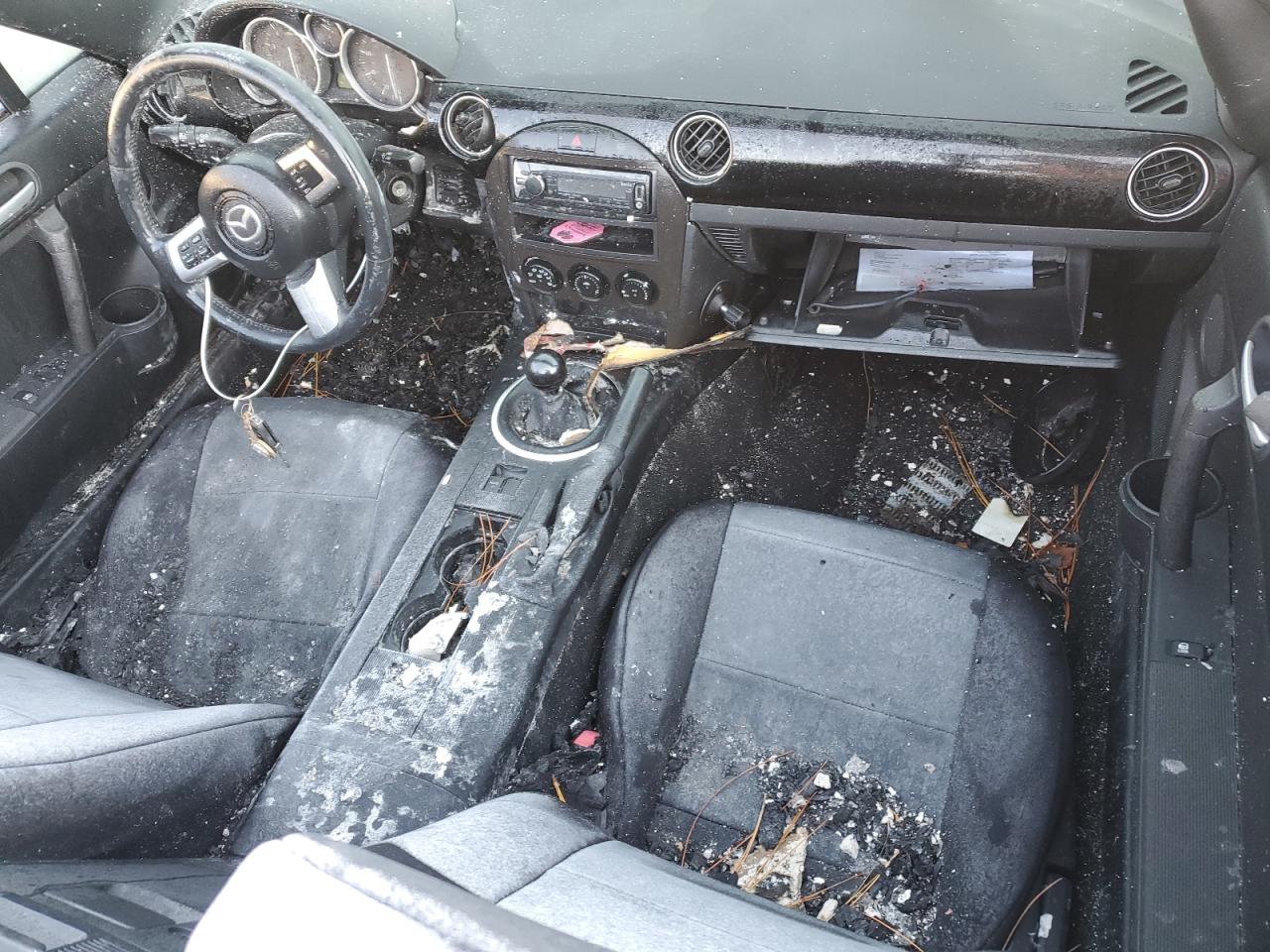 2006 Mazda MX-5 VIN JM1NC25F060101411 Copart auction photo, burn - interior damage thumbnail 8