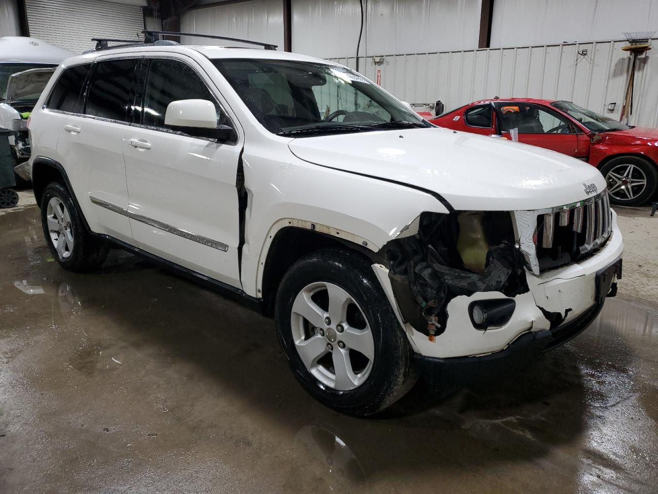 2011 Jeep Grand Cherokee VIN 1J4RR4GG3BC613233 Copart auction photo, front end / side damage thumbnail 4
