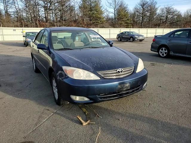 2003 Toyota Camry VIN 4T1BE30KX3U646717 Copart auction photo, rear end / minor dent/scratches damage thumbnail 10