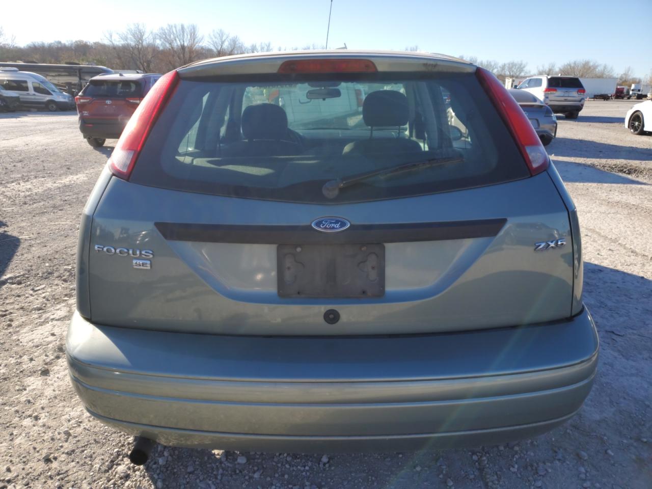 2005 Ford Focus VIN 3FAFP37N05R131645 Copart auction photo, side / all over damage thumbnail 6