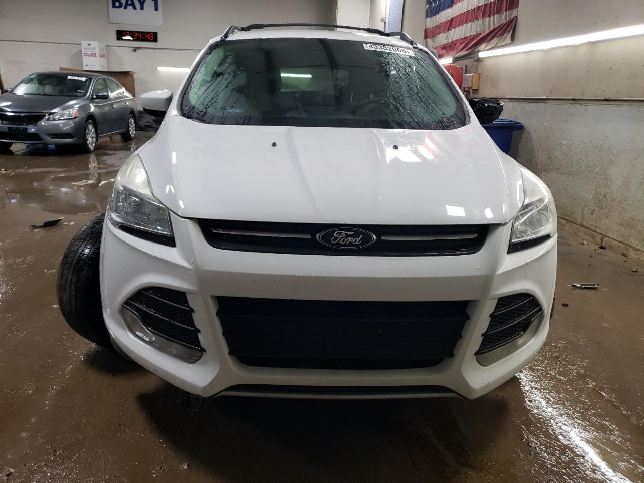 2016 Ford Escape VIN 1FMCU0GX9GUA76884 Copart auction photo, side / front end damage thumbnail 5