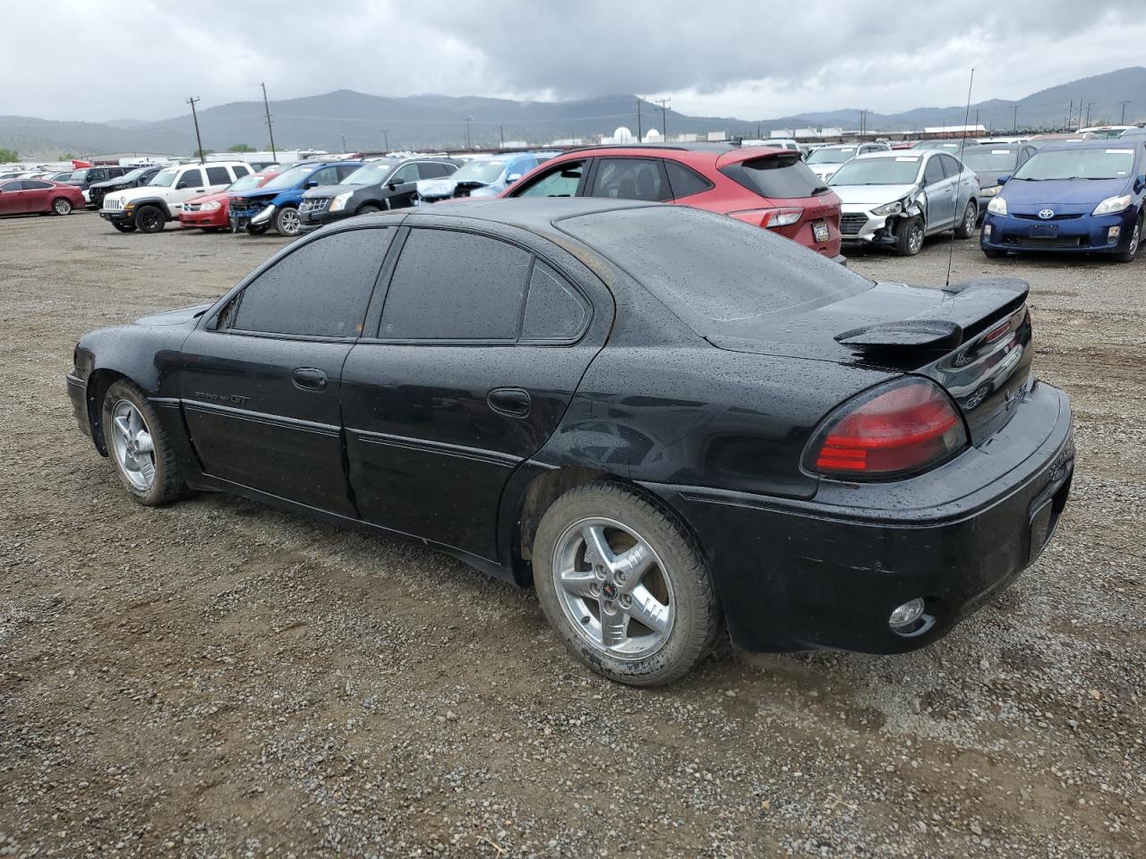 2000 Pontiac Grand AM VIN 1G2NV52E1YM822599 Copart auction photo, burn damage thumbnail 2