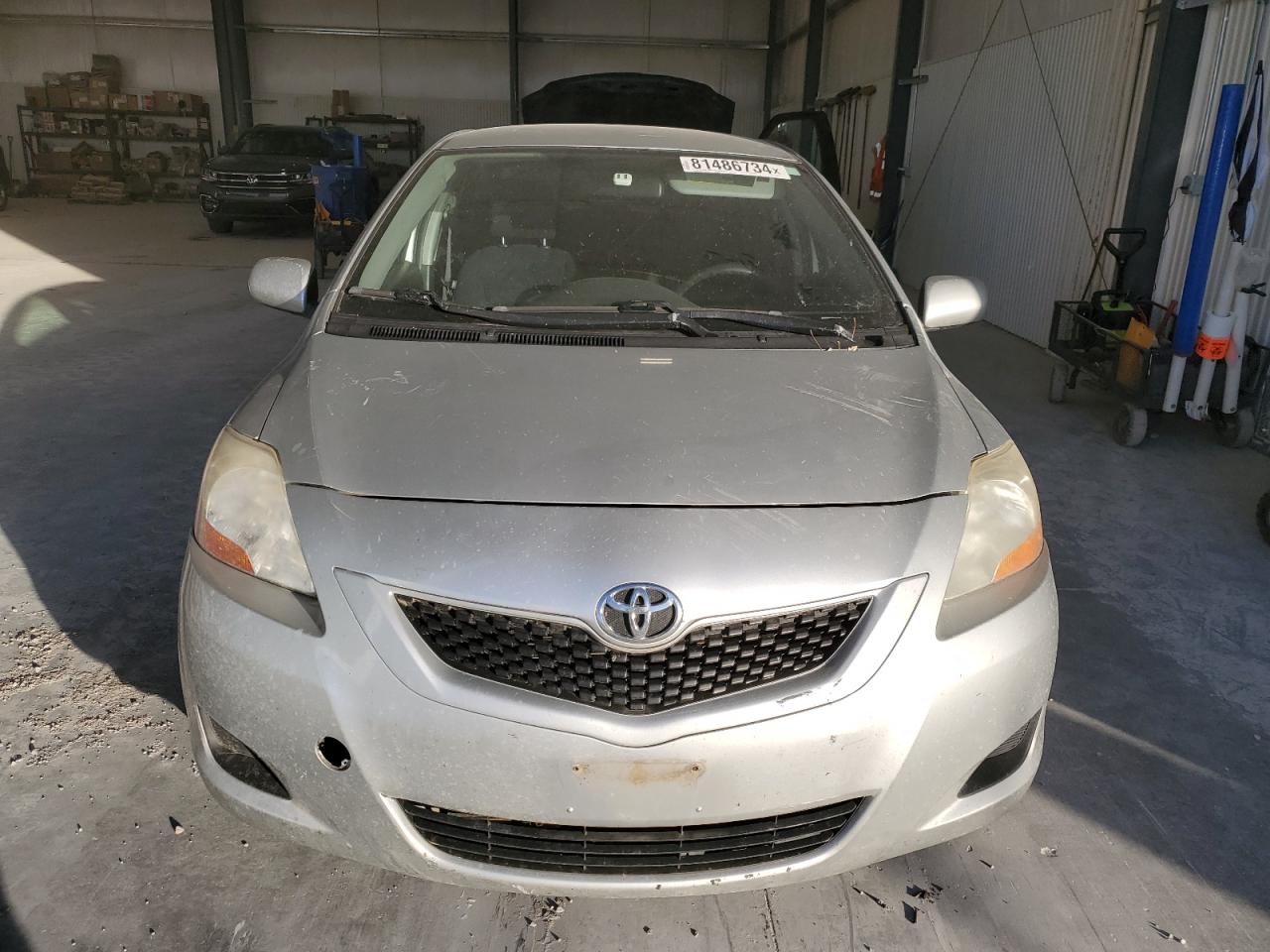 2010 Toyota Yaris VIN JTDBT4K32A1365810 Copart auction photo, rear end damage thumbnail 5