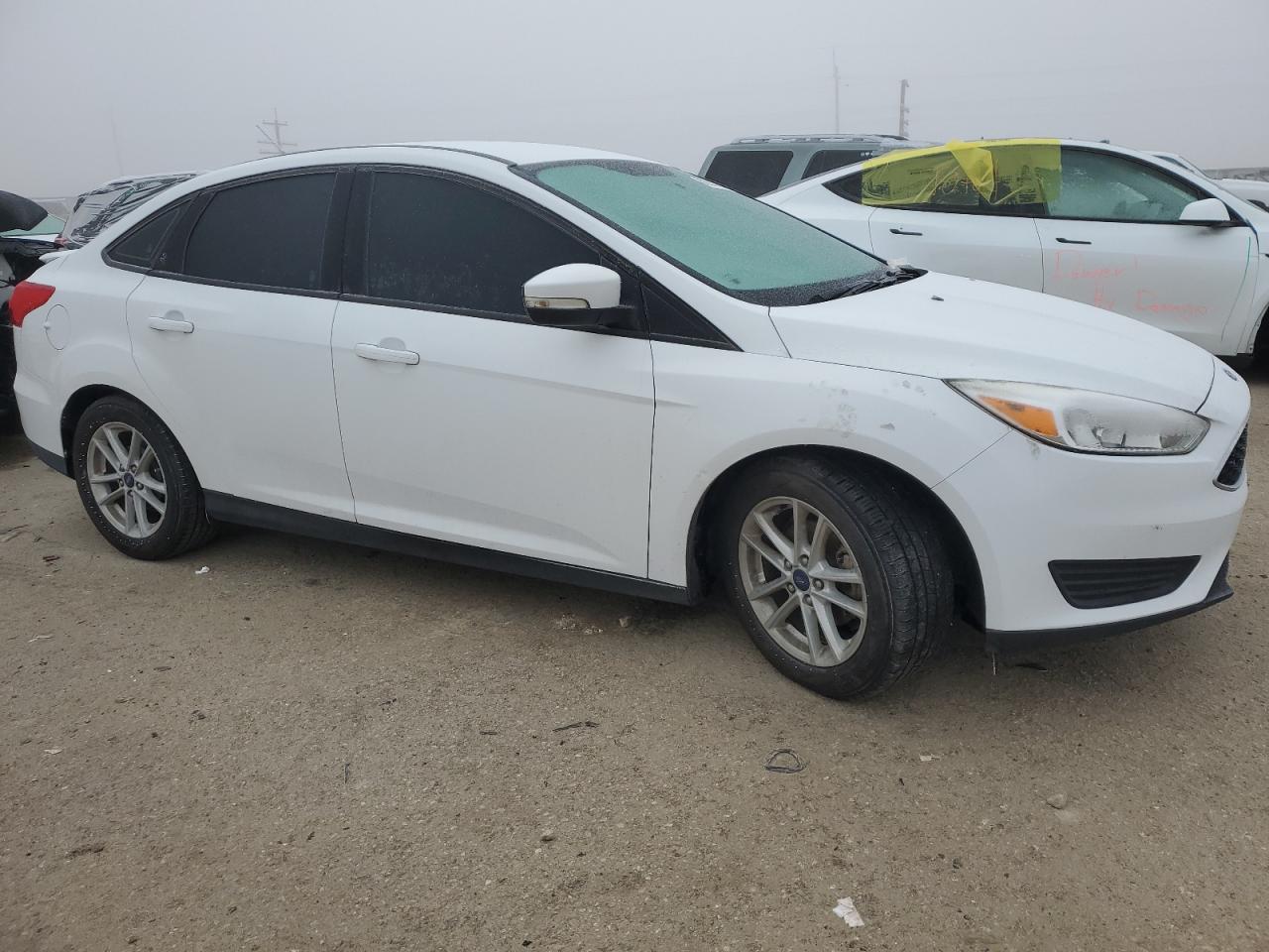 2016 Ford Focus VIN 1FADP3F20GL306556 Copart auction photo, all over damage thumbnail 4
