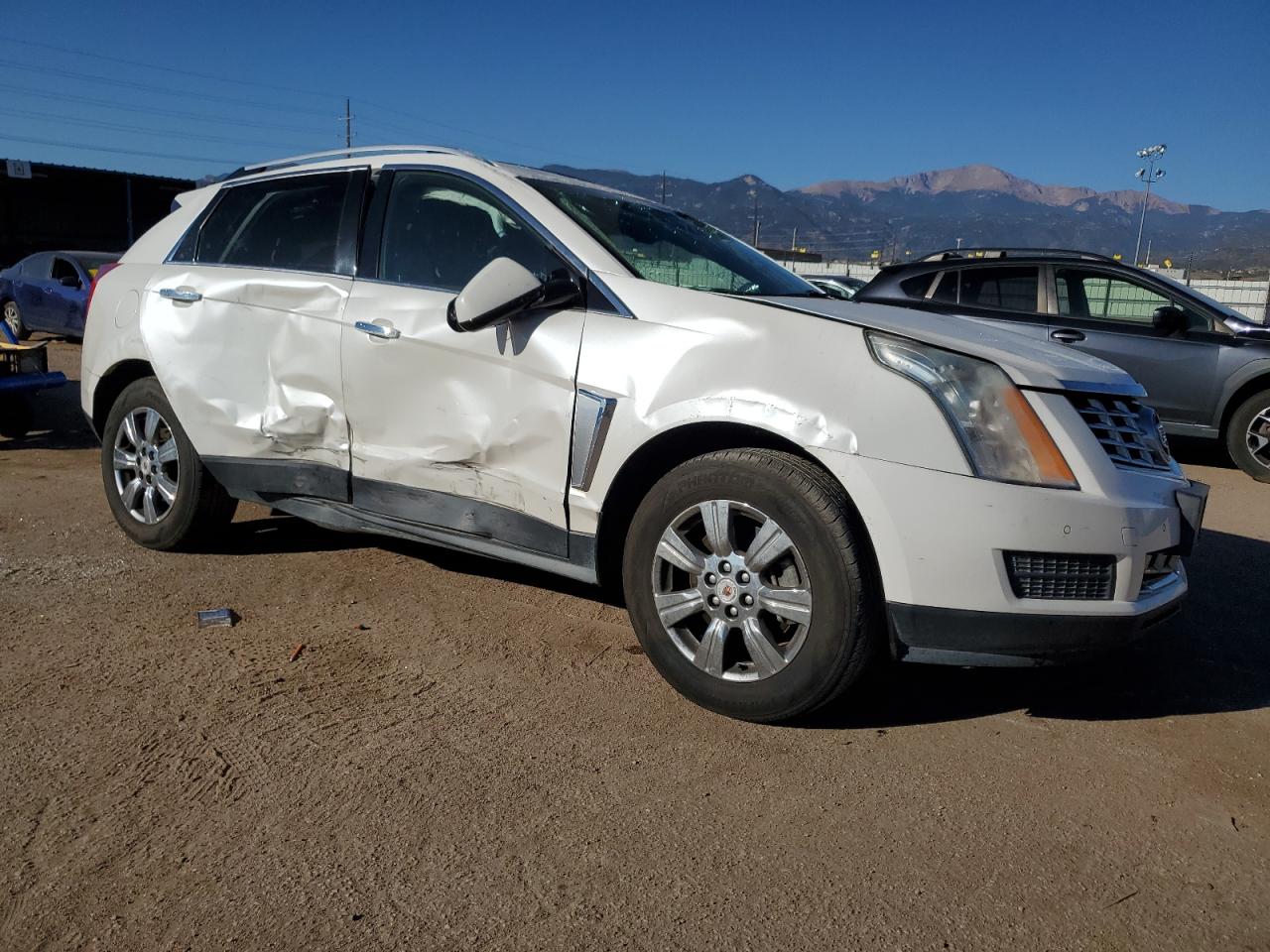 2015 Cadillac SRX VIN 3GYFNEE37FS518288 Copart auction photo, all over damage thumbnail 4
