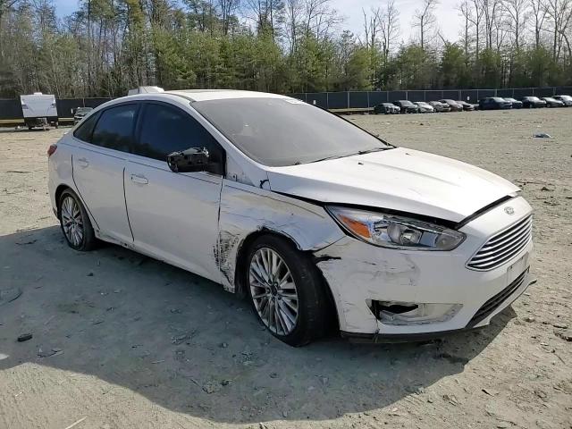 2015 Ford Focus VIN 1FADP3J28FL378093 Copart auction photo, vandalism / all over damage thumbnail 11