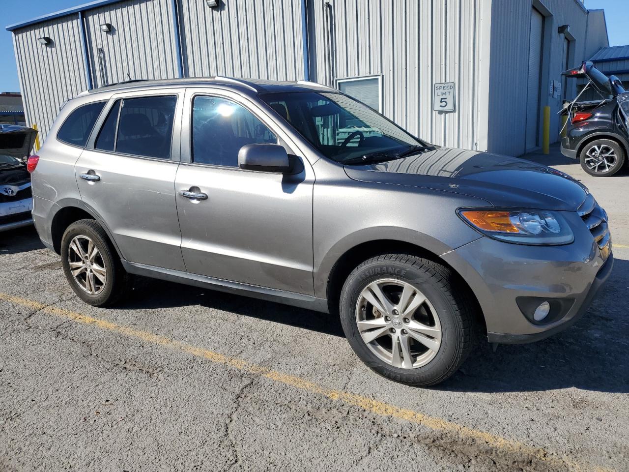 2012 Hyundai Santa Fe VIN 5XYZKDAG0CG104961 Copart auction photo, front end / side damage thumbnail 4
