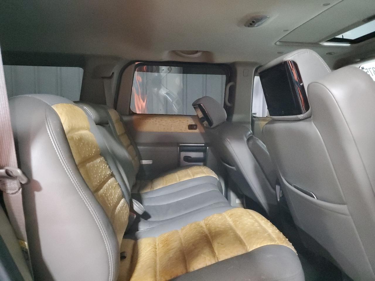 2003 Hummer H2 VIN 5GRGN23U73H127407 Copart auction photo, side / rear end damage thumbnail 11
