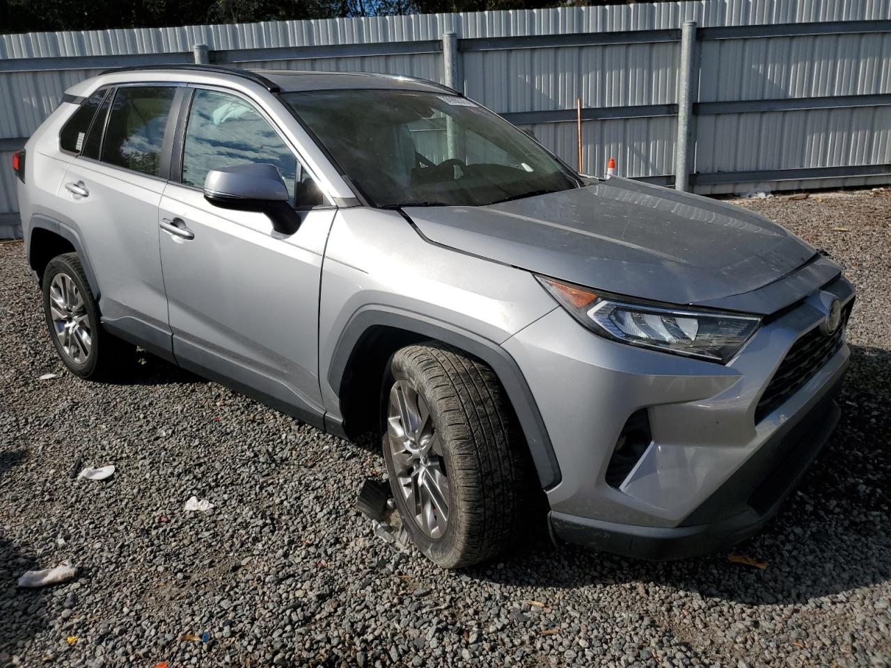 2020 Toyota RAV 4 VIN 2T3C1RFV6LW058776 Copart auction photo, side / front end damage thumbnail 4