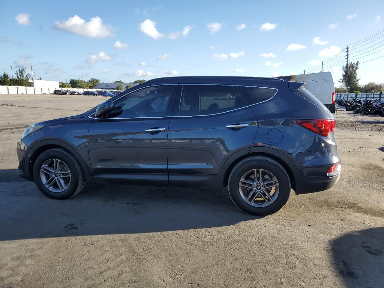 2017 Hyundai Santa Fe VIN 5NMZU3LB9HH002822 Copart auction photo, all over damage thumbnail 2
