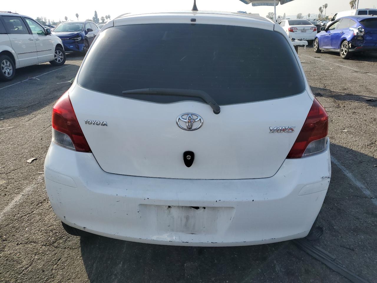2010 Toyota Yaris VIN JTDKT4K36A5323097 Copart auction photo, front end damage thumbnail 6