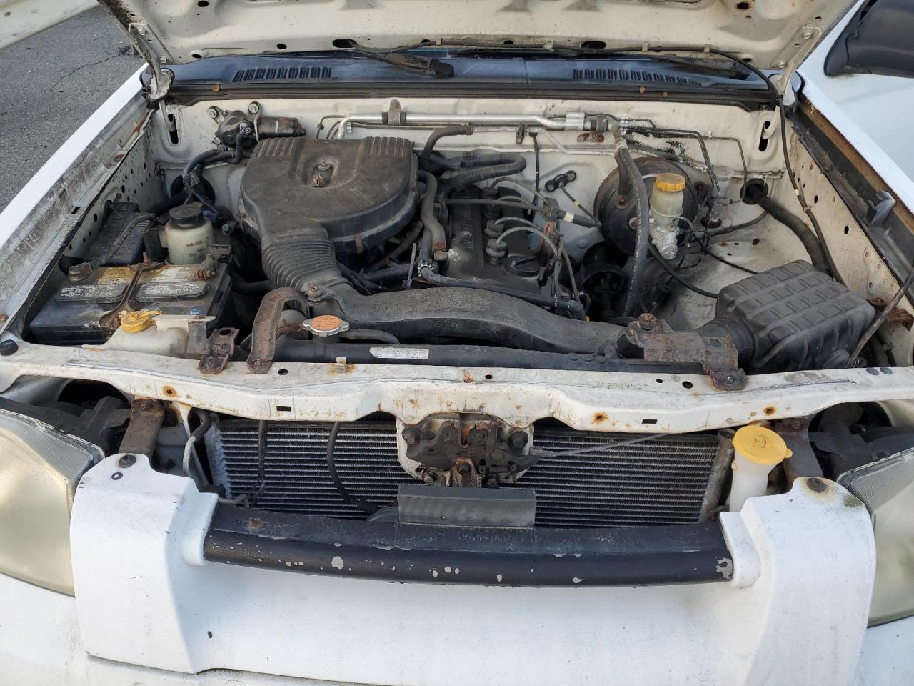 2002 Nissan Navara (Frontier) VIN 1N6DD26S82C353952 Copart auction photo, side / minor dent/scratches damage thumbnail 11