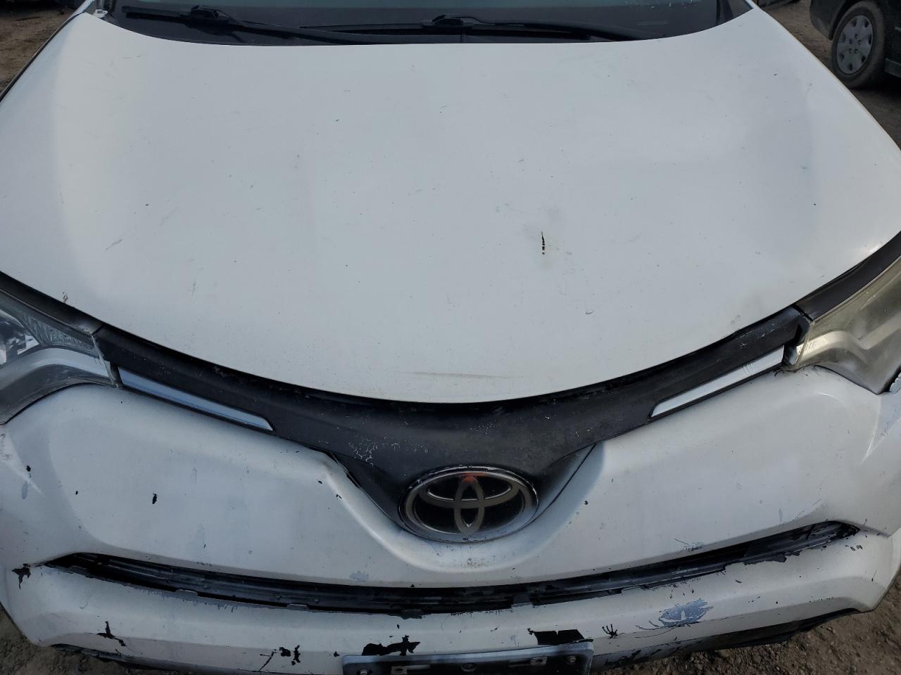 2018 Toyota RAV 4 VIN JTMZFREV2JJ747934 Copart auction photo, side / front end damage thumbnail 11