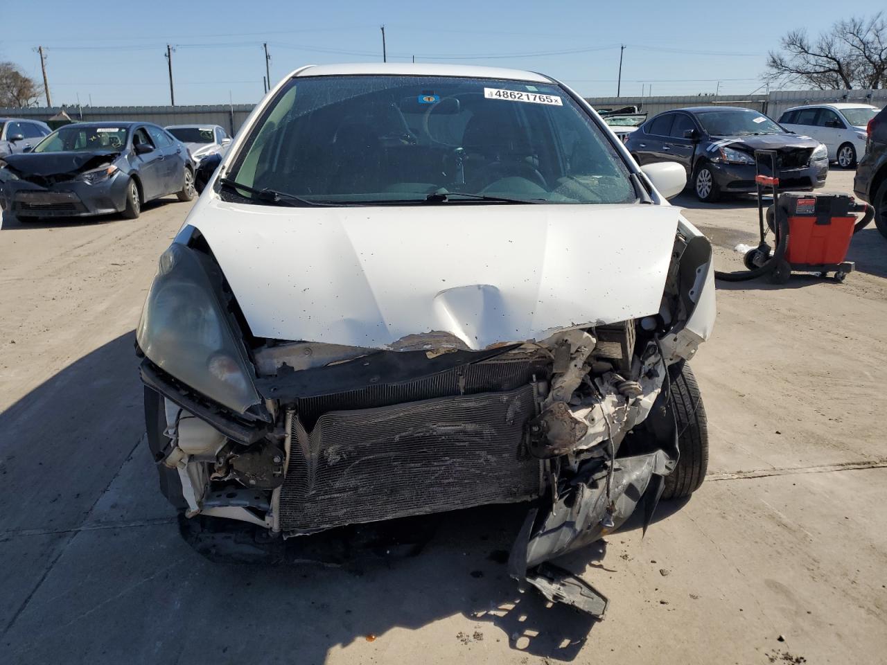 2012 Honda Fit VIN JHMGE8H34CC020833 Copart auction photo, front end / hail damage thumbnail 5