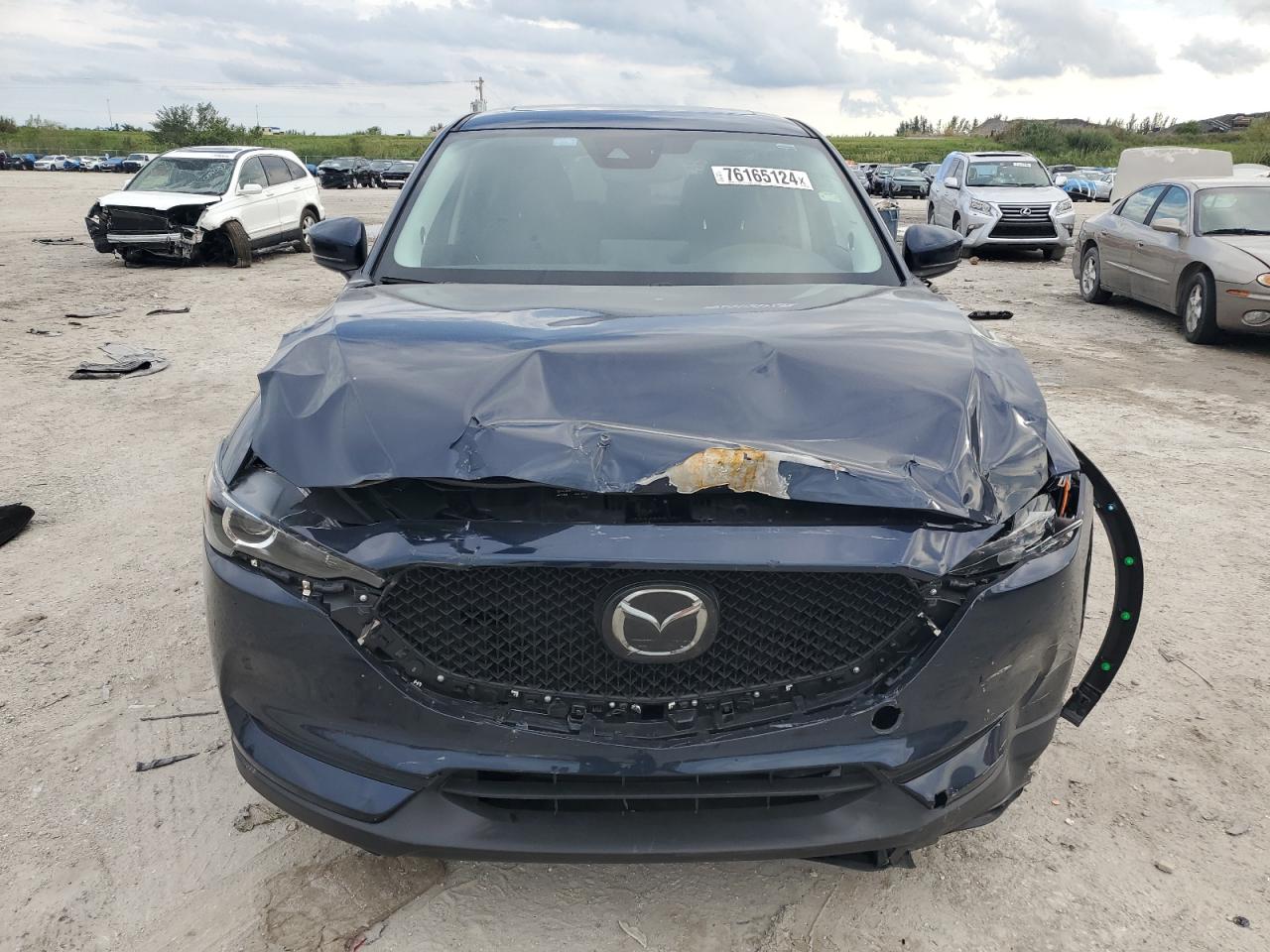 2021 Mazda CX-5 VIN JM3KFACM8M0415494 Copart auction photo, front end / minor dent/scratches damage thumbnail 5
