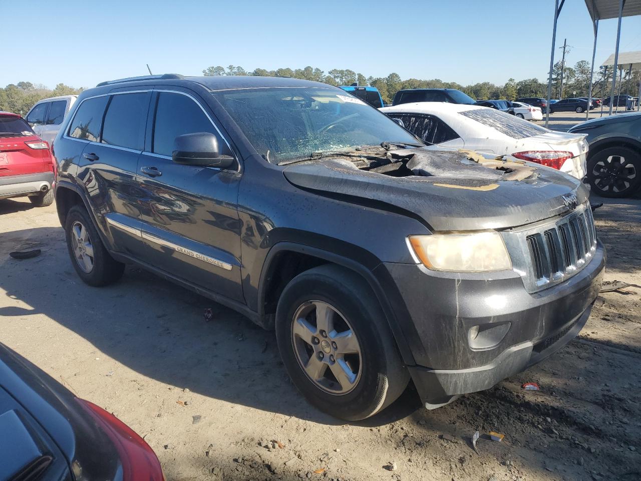 2013 Jeep Grand Cherokee VIN 1C4RJEAG4DC504097 Copart auction photo, burn damage thumbnail 4