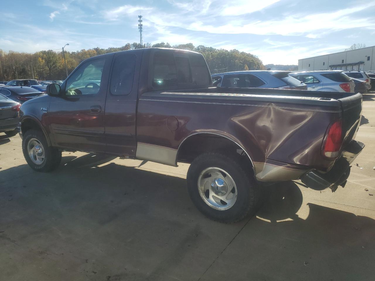 2000 Ford F-150 VIN 1FTRX18W7YNA67100 Copart auction photo, side / rear end damage thumbnail 2