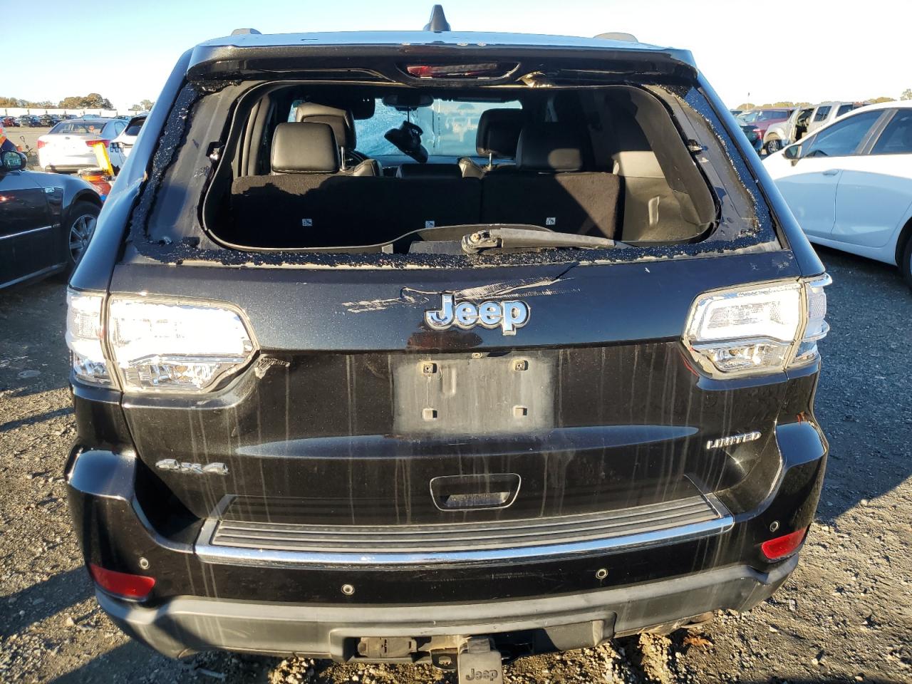 2015 Jeep Grand Cherokee VIN 1C4RJFBG9FC839525 Copart auction photo, vandalism damage thumbnail 6