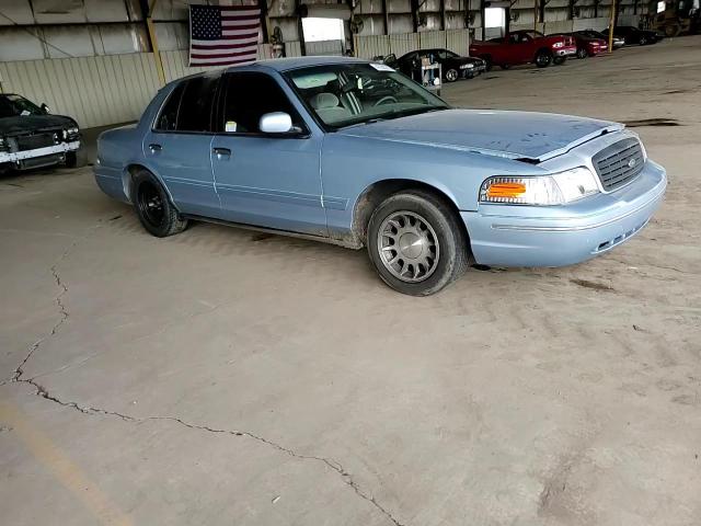 1999 Ford Crown Victoria VIN 2FAFP74W2XX159035 Copart auction photo, side / front end damage thumbnail 10
