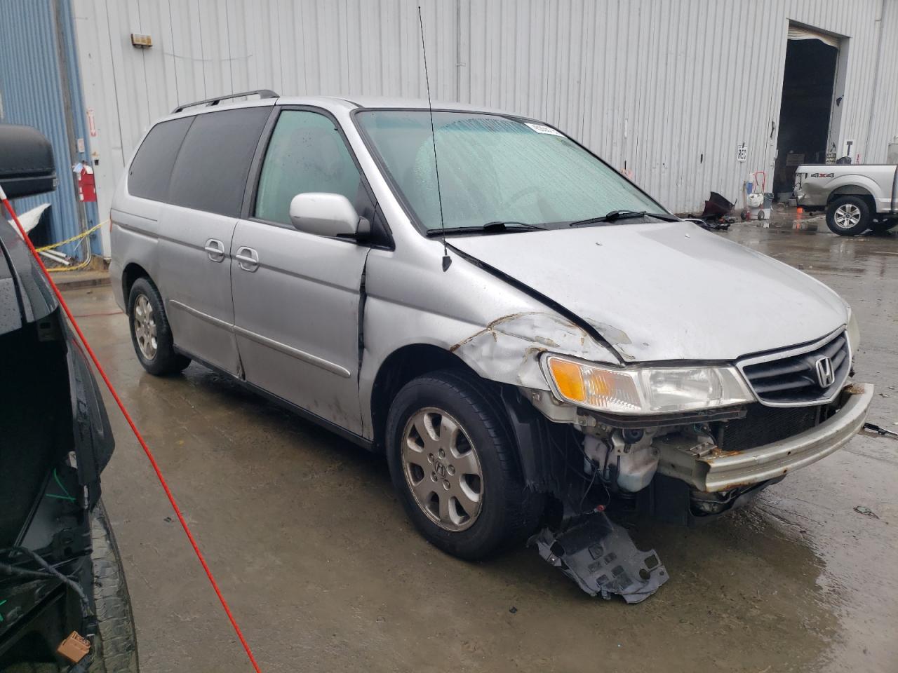 2004 Honda Odyssey VIN 2HKRL18684H500736 Copart auction photo, front end / side damage thumbnail 4