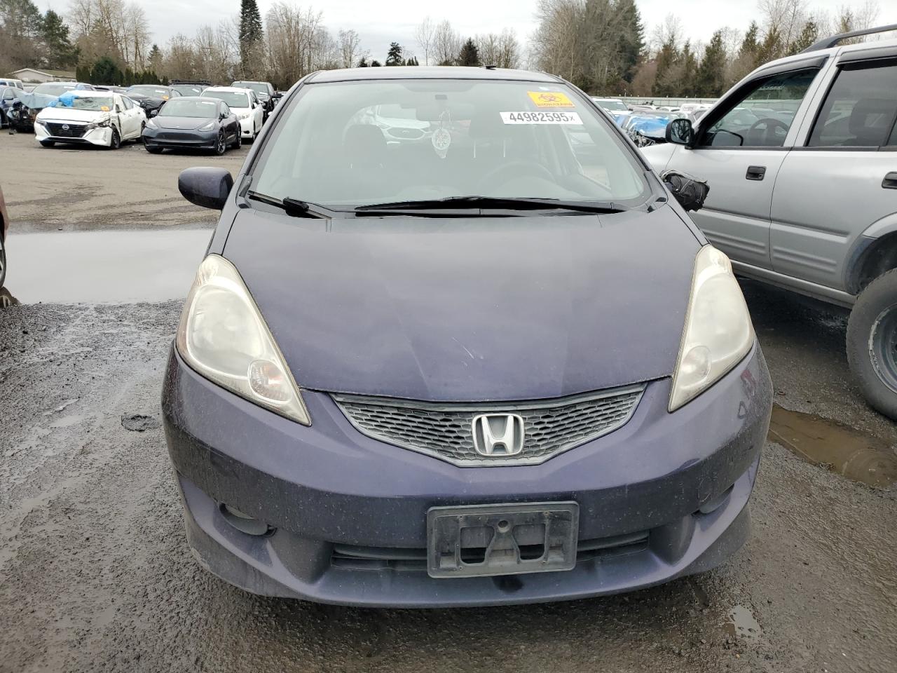 2010 Honda Fit VIN JHMGE8H41AC028247 Copart auction photo, side damage thumbnail 5
