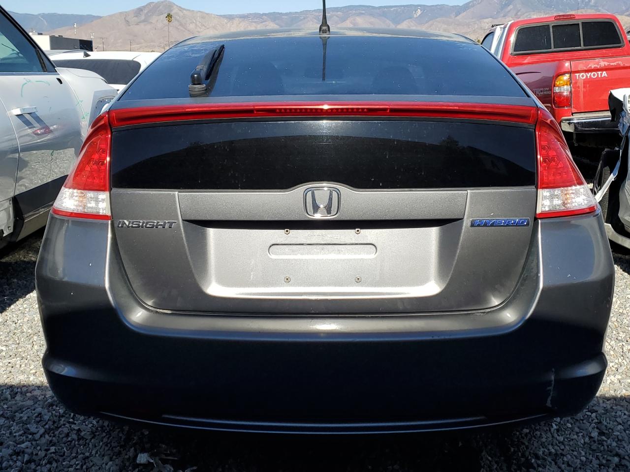 2010 Honda Insight VIN JHMZE2H72AS033494 Copart auction photo, all over damage thumbnail 6