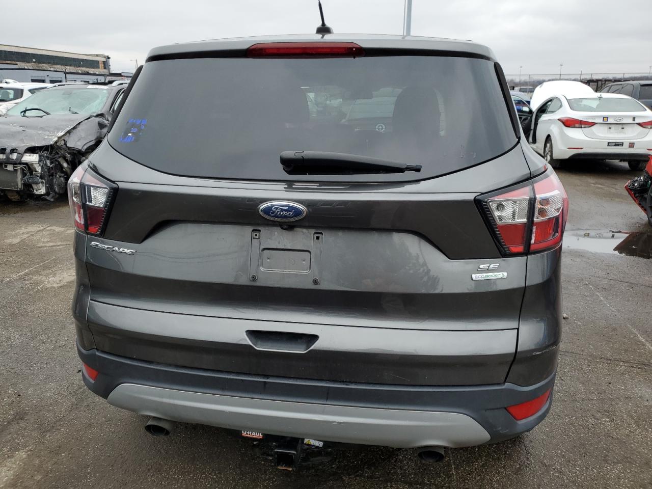 2017 Ford Escape VIN 1FMCU0GDXHUD08349 Copart auction photo, side damage thumbnail 6