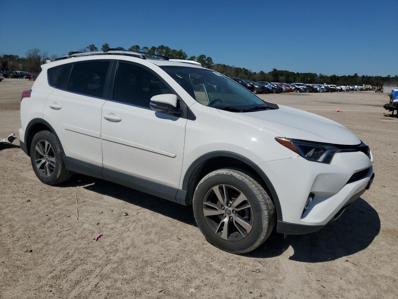 2016 Toyota RAV 4 VIN 2T3WFREV7GW257521 Copart auction photo, side / minor dent/scratches damage thumbnail 4