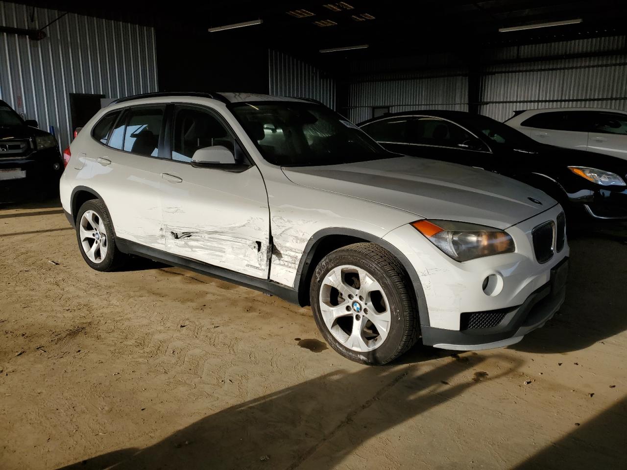2015 BMW X1 VIN WBAVM1C50FVW58031 Copart auction photo, side / front end damage thumbnail 4