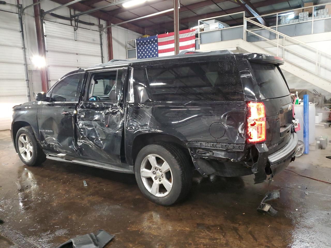 2015 Chevrolet Suburban VIN 1GNSKJKCXFR717159 Copart auction photo, side / rear end damage thumbnail 2