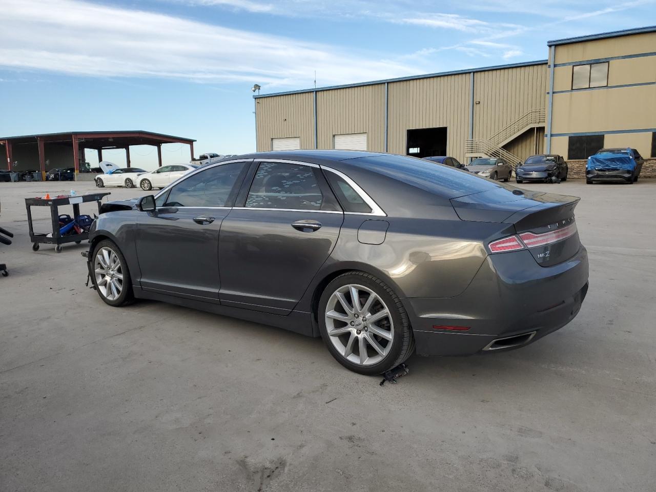 2016 Lincoln MKZ VIN 3LN6L2LUXGR618086 Copart auction photo, front end / hail damage thumbnail 2