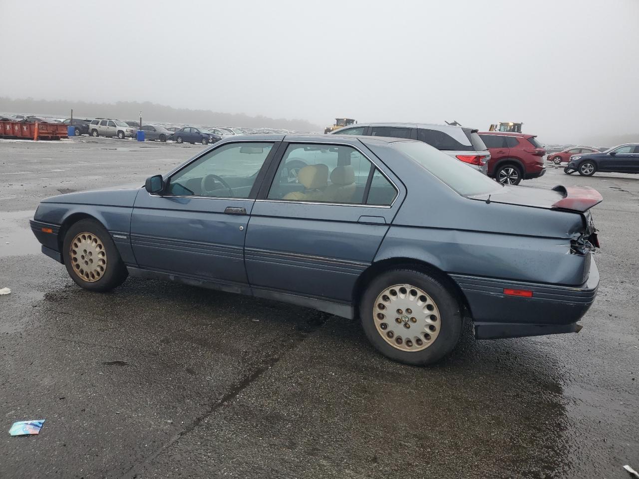 1991 Alfa Romeo 164 VIN ZAREA43L5M6171139 Copart auction photo, rear end / minor dent/scratches damage thumbnail 2
