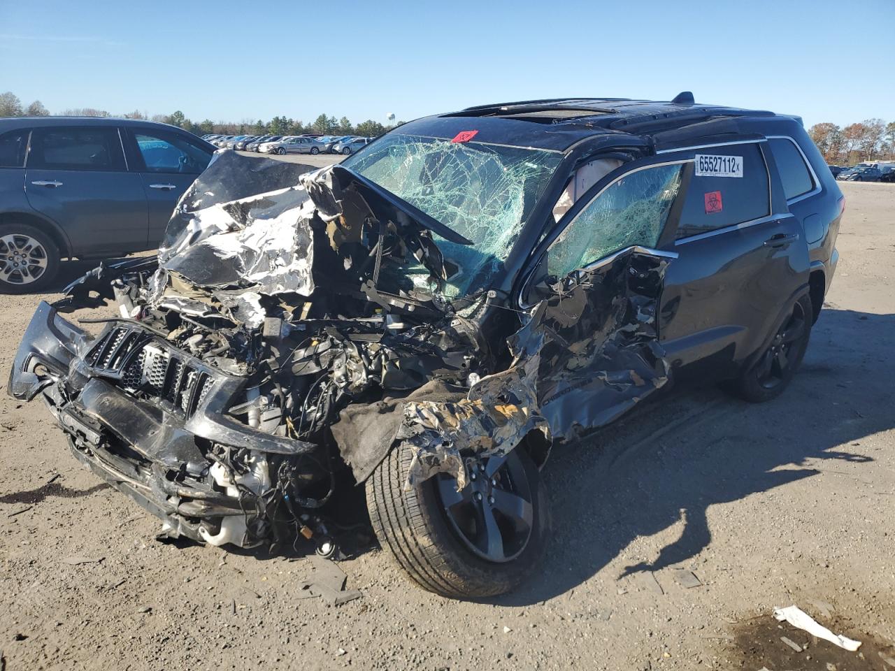 2015 Jeep Grand Cherokee VIN 1C4RJFAG0FC134873 Copart auction photo, front end / side damage thumbnail 2