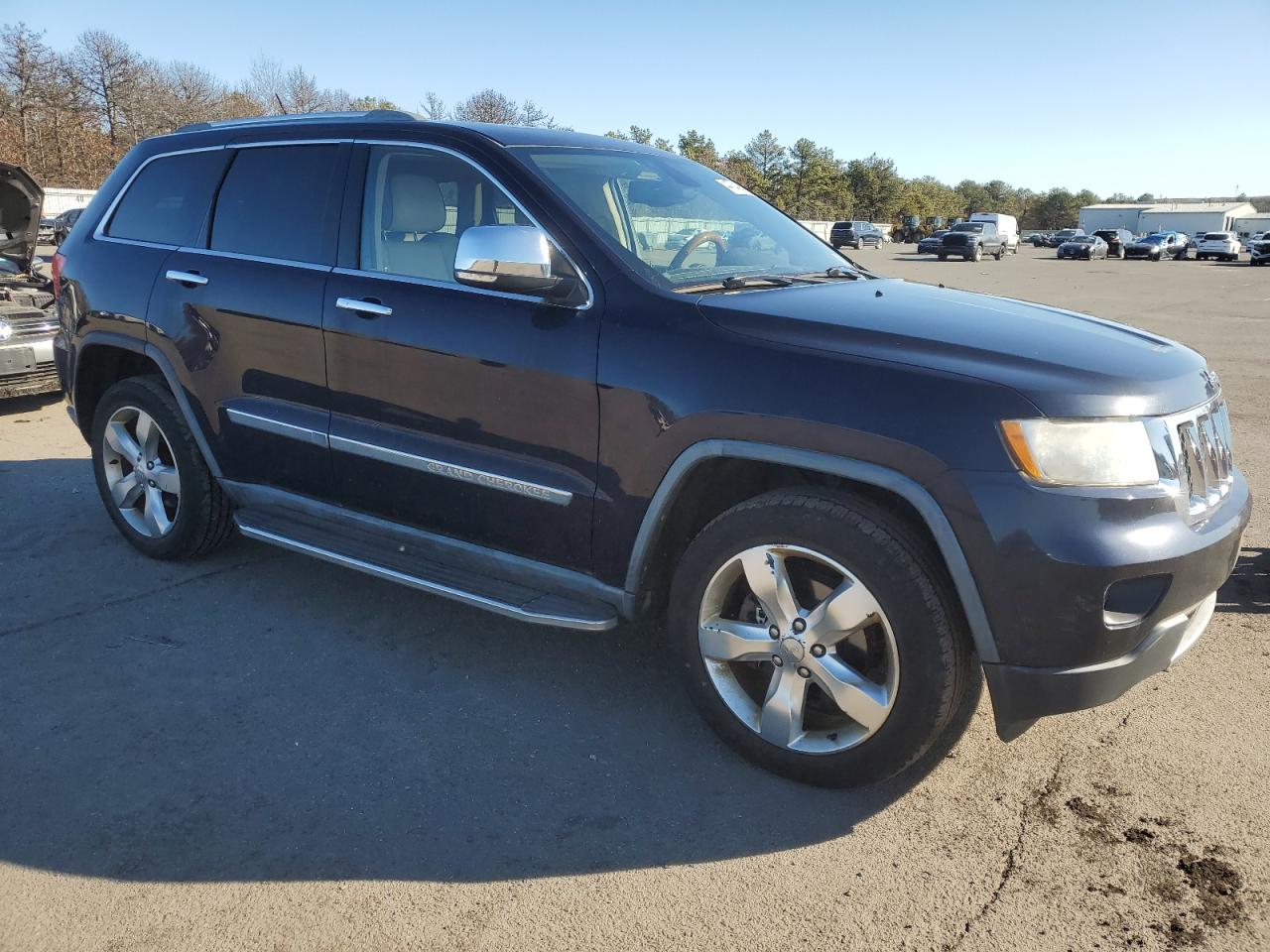 2011 Jeep Grand Cherokee VIN 1J4RR6GGXBC603424 Copart auction photo, side / minor dent/scratches damage thumbnail 4
