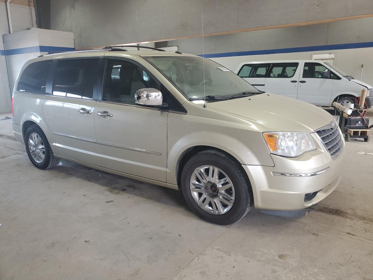 2010 Chrysler Town & Country VIN 2A4RR6DX4AR149603 Copart auction photo, front end / side damage thumbnail 4