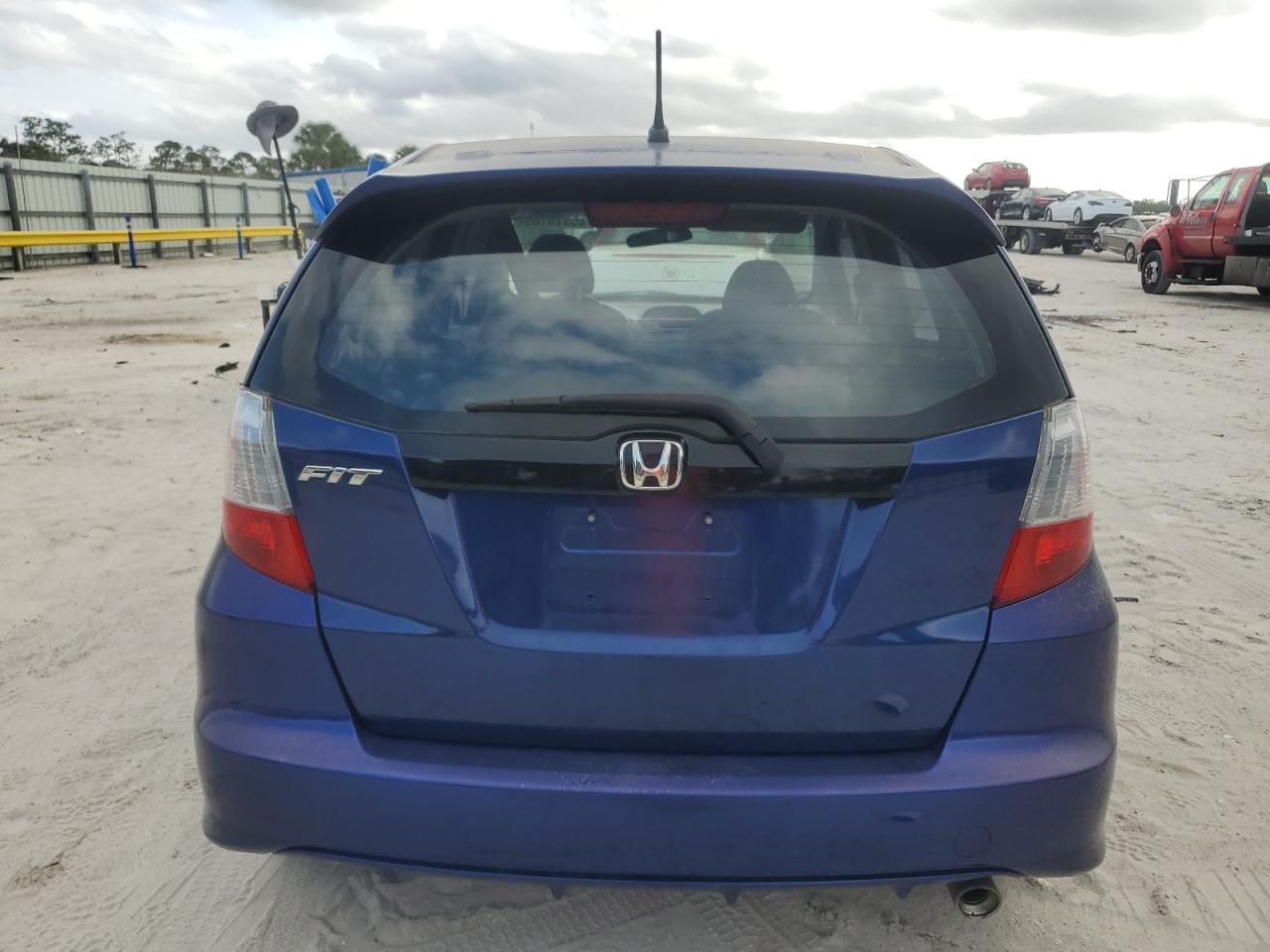2011 Honda Fit VIN JHMGE8H51BC007229 Copart auction photo, side damage thumbnail 6