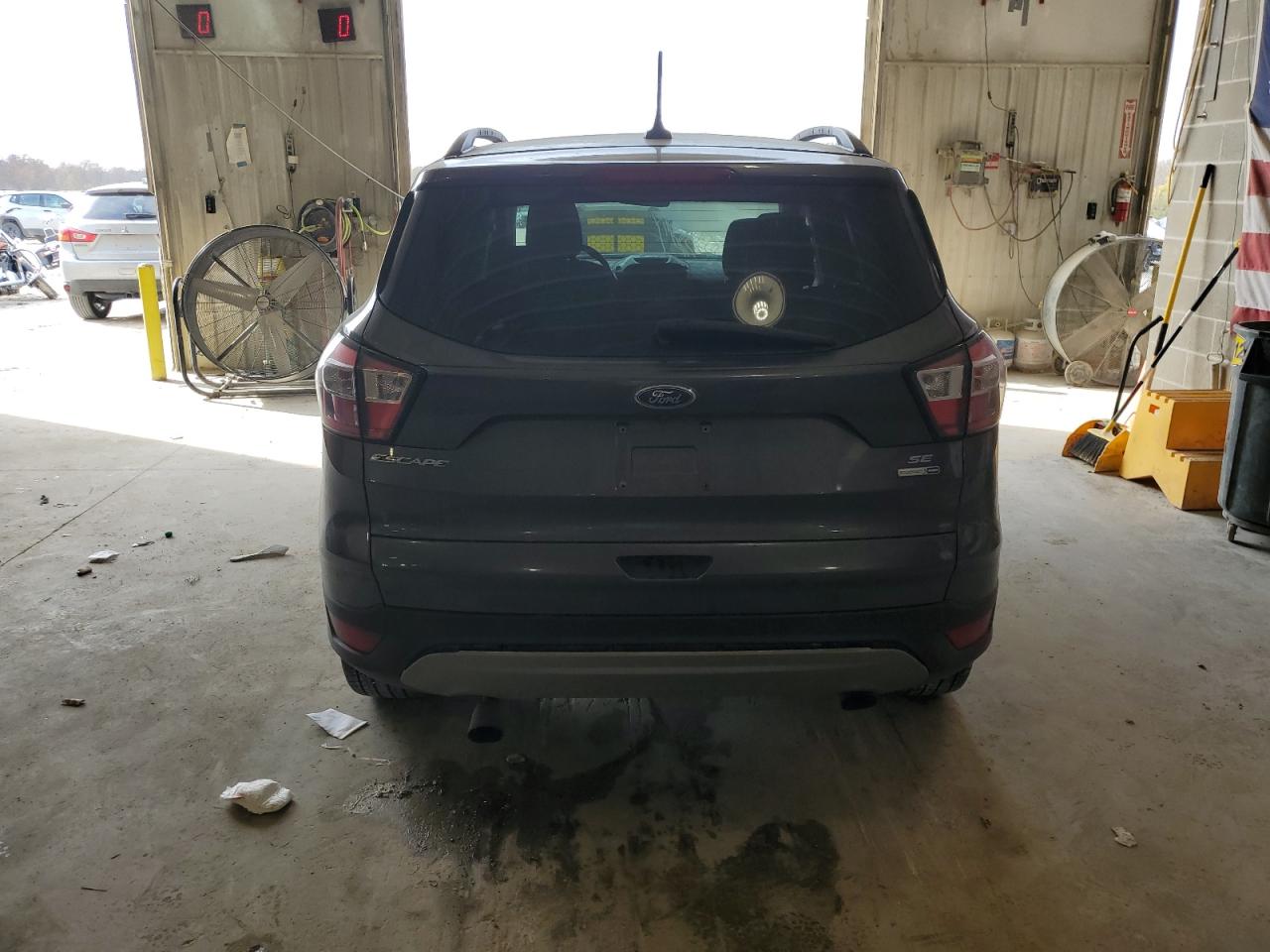 2018 Ford Escape VIN 1FMCU9GD0JUB23057 Copart auction photo, front end / side damage thumbnail 6