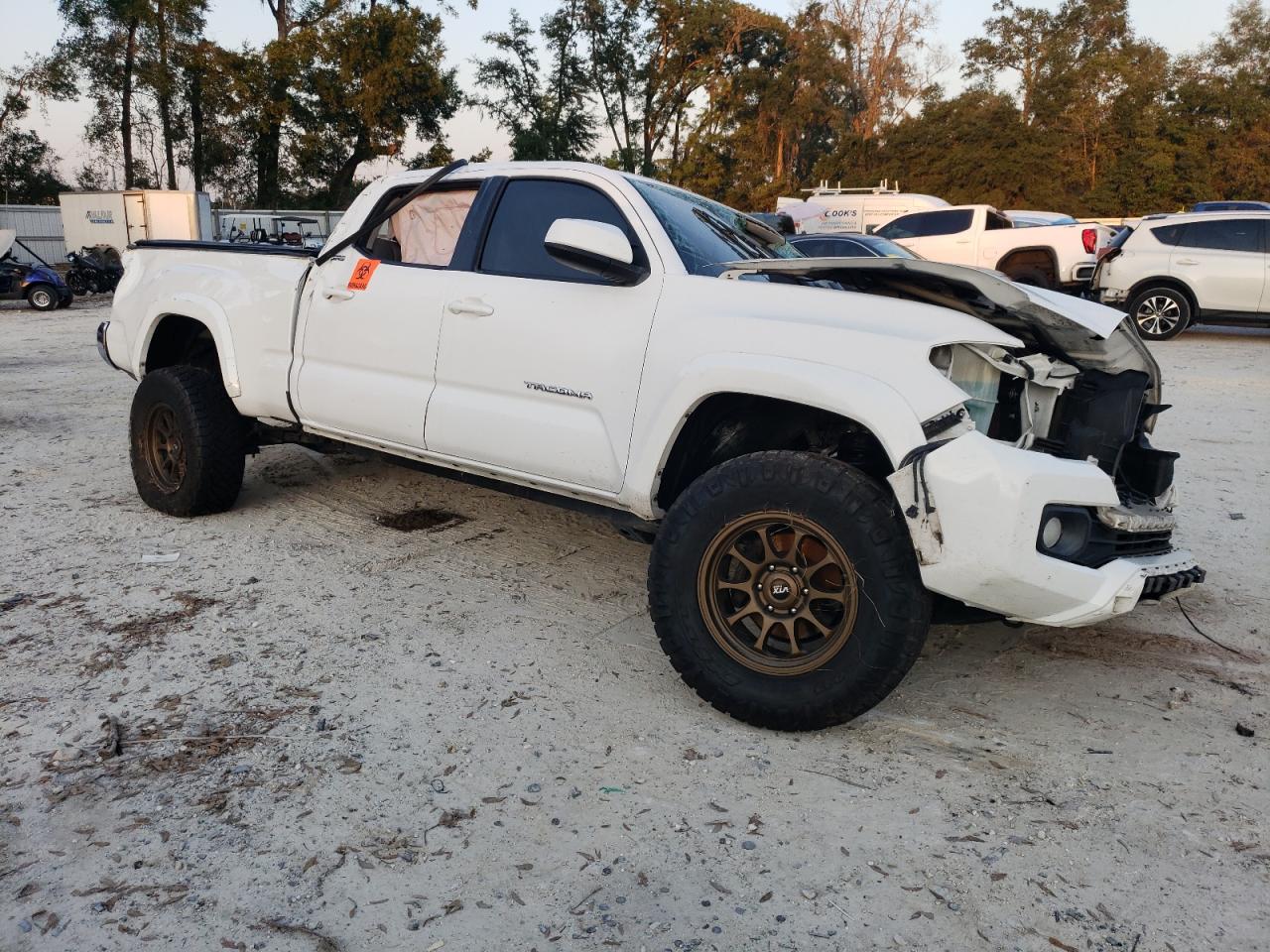 2017 Toyota Tacoma VIN 3TMDZ5BN4HM020094 Copart auction photo, rollover damage thumbnail 4