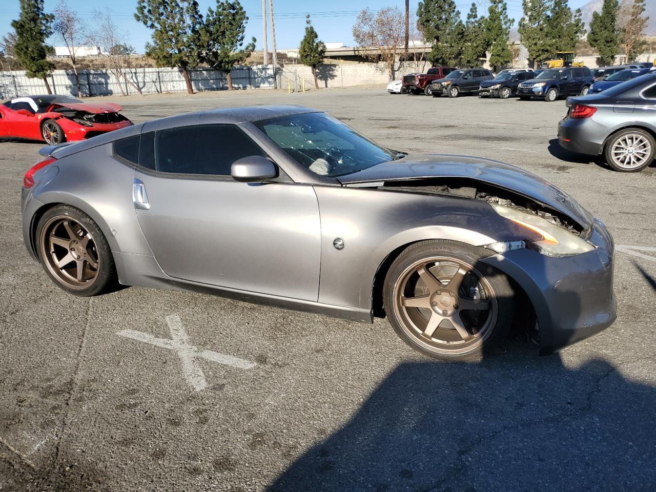 2009 Nissan 370Z VIN JN1AZ44E79M401576 Copart auction photo, front end / side damage thumbnail 4