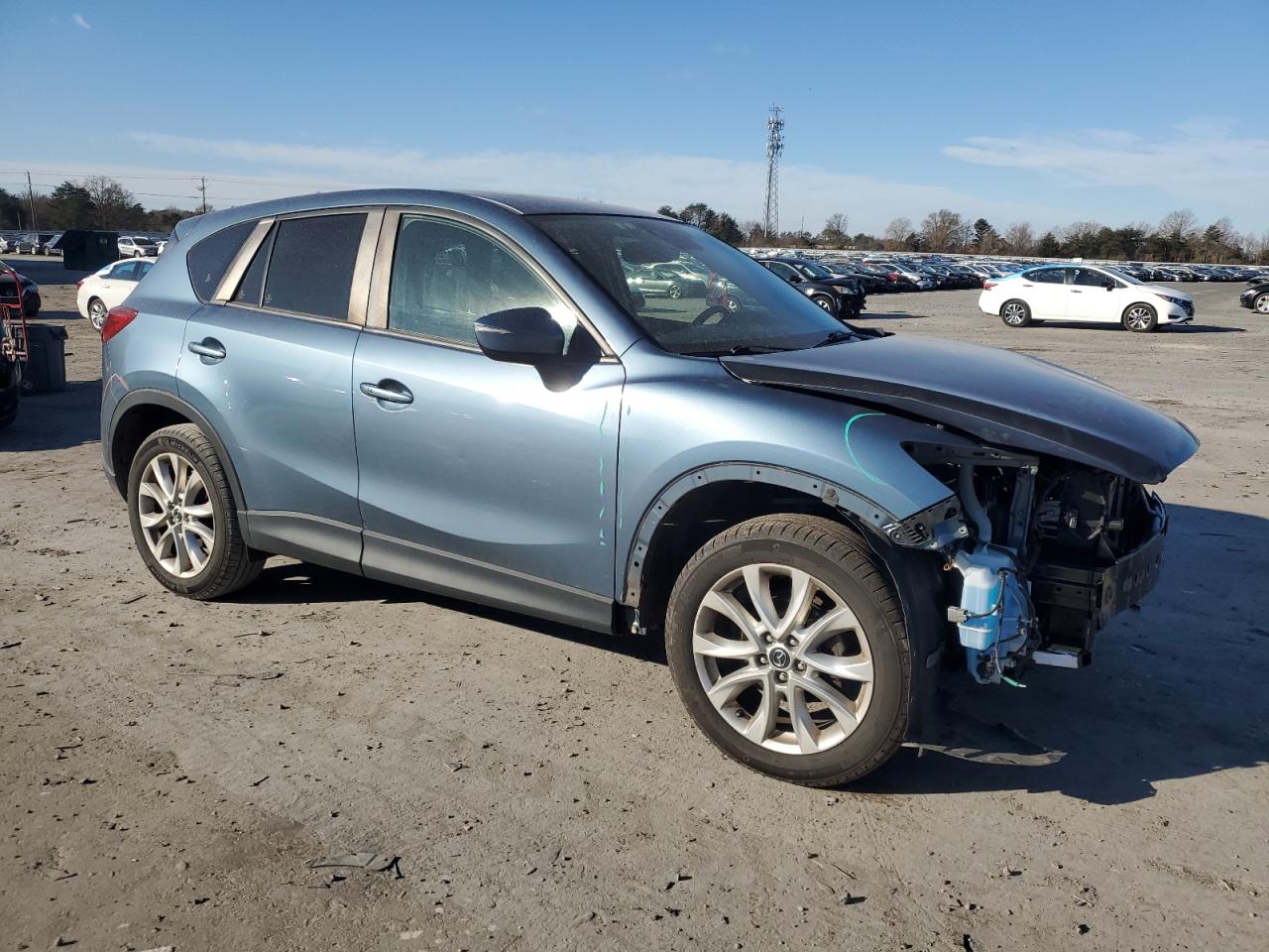 2015 Mazda CX-5 VIN JM3KE4DY6F0490333 Copart auction photo, front end / minor dent/scratches damage thumbnail 4