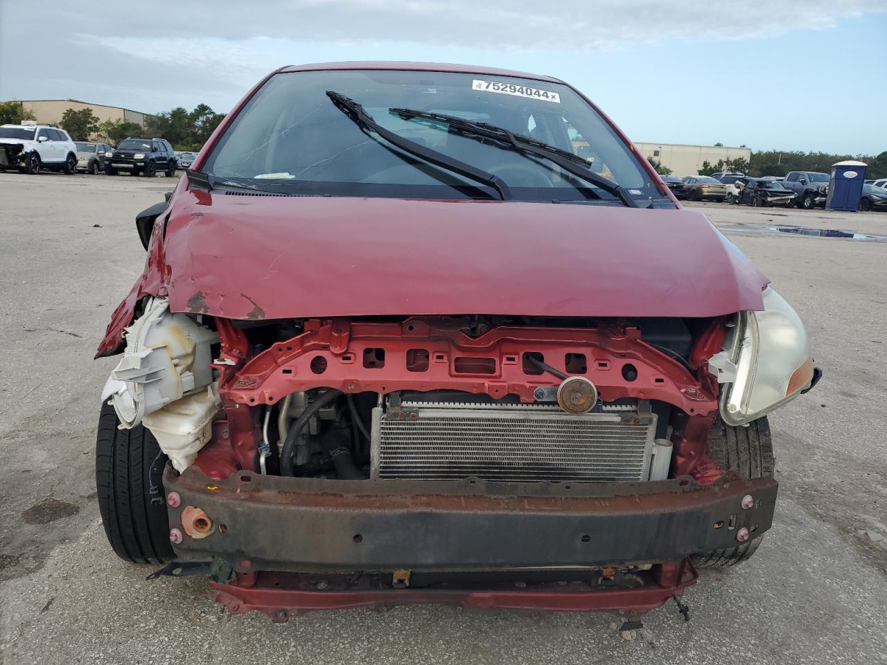 2011 Toyota Yaris VIN JTDBT4K38B1405955 Copart auction photo, all over damage thumbnail 5