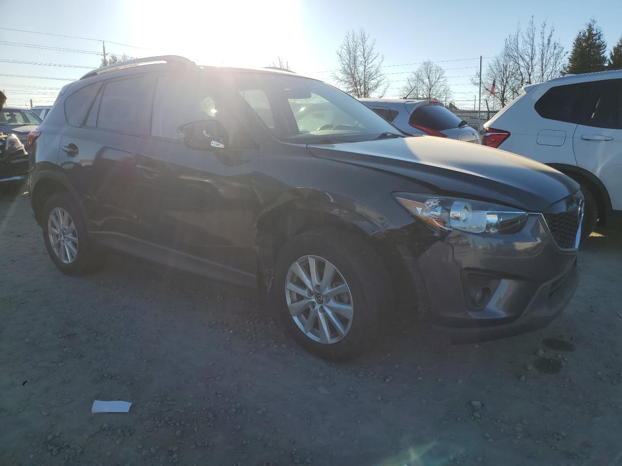 2014 Mazda CX-5 VIN JM3KE2CY1E0387874 Copart auction photo, front end / undercarriage damage thumbnail 4